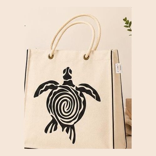Natural jute-look tote with black sea turtle print and rope handles